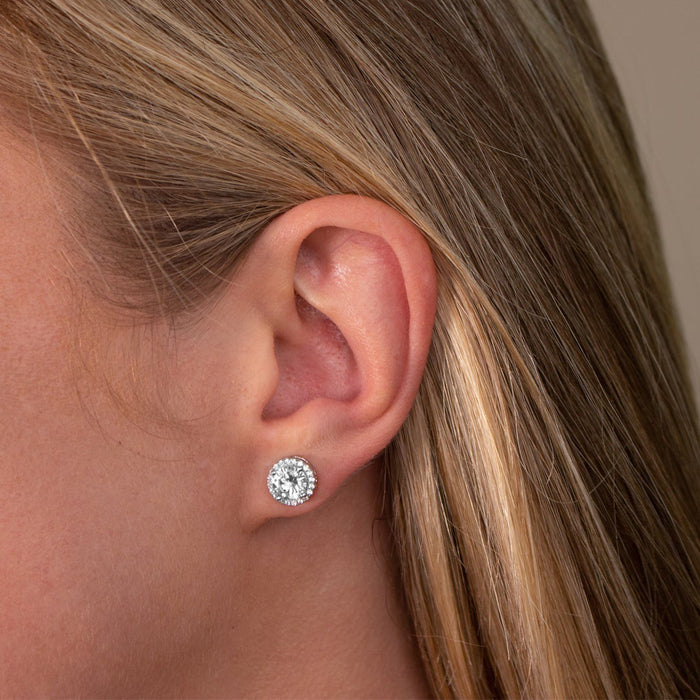 From the Anastasia Collection by Anna Zuckerman Luxury, Sterling Silver CZ Halo Stud Earrings.