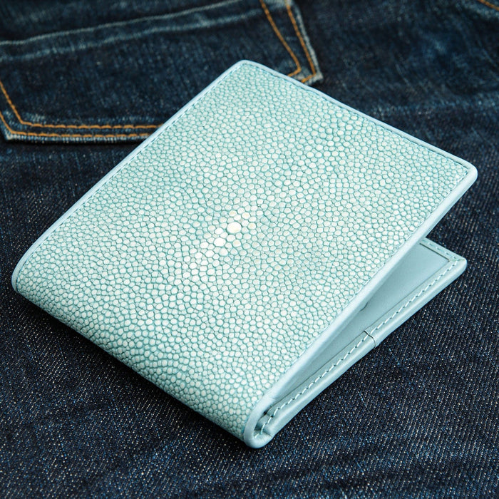 A classic bifold wallet made from genuine stingray skin in a vibrant and unique turquoise color.