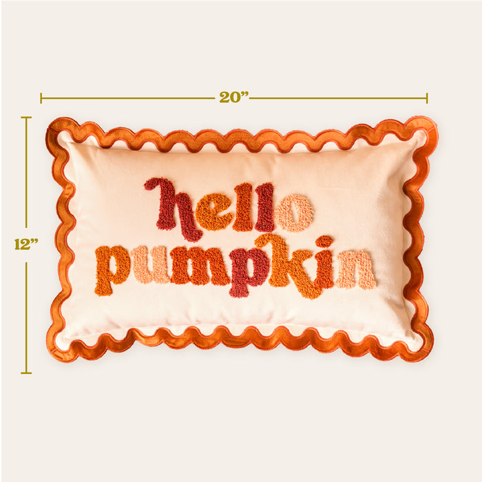 The Darling Effect's Hello Pumpkin Scalloped Rectangle Throw Pillow measures 20"x12", features orange wavy trim, and "hello pumpkin" in textured orange/red textβperfect for adding a cozy touch to your throw pillow collection.