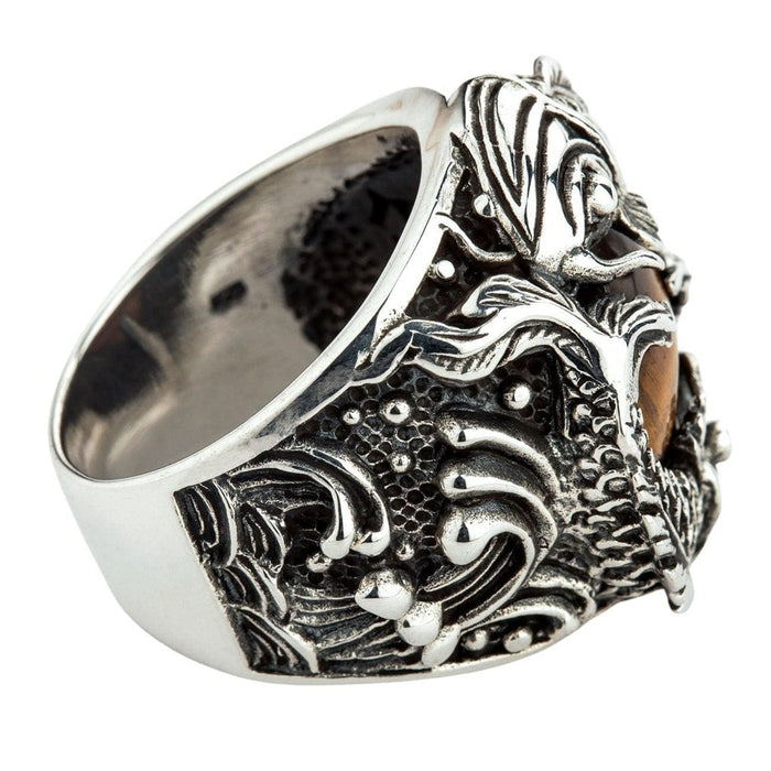Band detail of handcrafted sterling silver koi fish ring showing wave patterns and oxidized finish