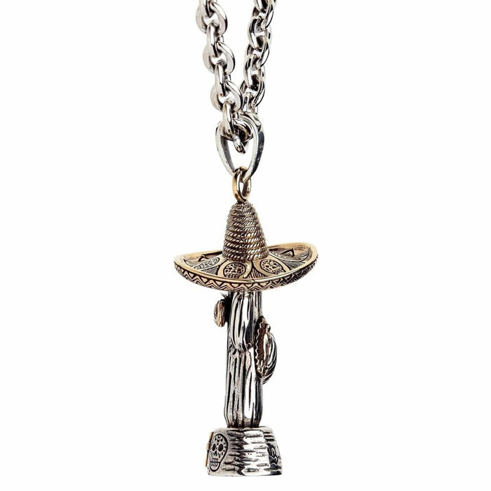 Side view of cactus sombrero pendant showing sugar skull engravings on base