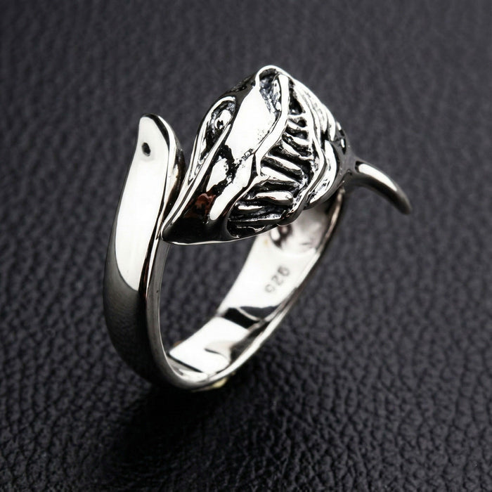 The polished silver predator shark ring, highlighting its brilliant shine.