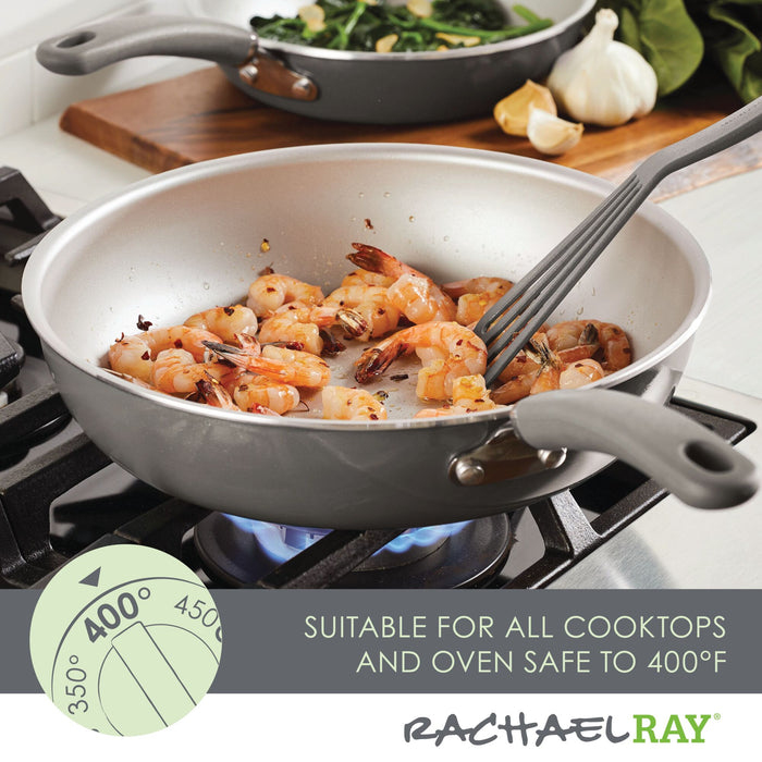 Shrimp cooks in the 13-Piece Nonstick Induction Cookware Set, stirred with a spatula.