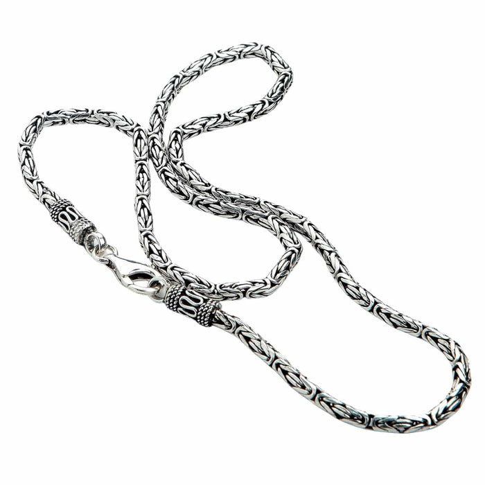 Coiled Byzantine chain in 925 sterling silver displaying oxidized finish and handcrafted end caps