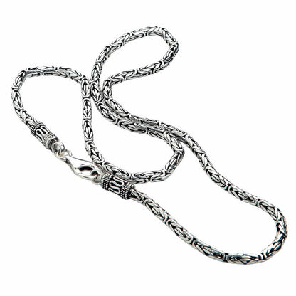 Coiled Byzantine chain in 925 sterling silver displaying oxidized finish and handcrafted end caps