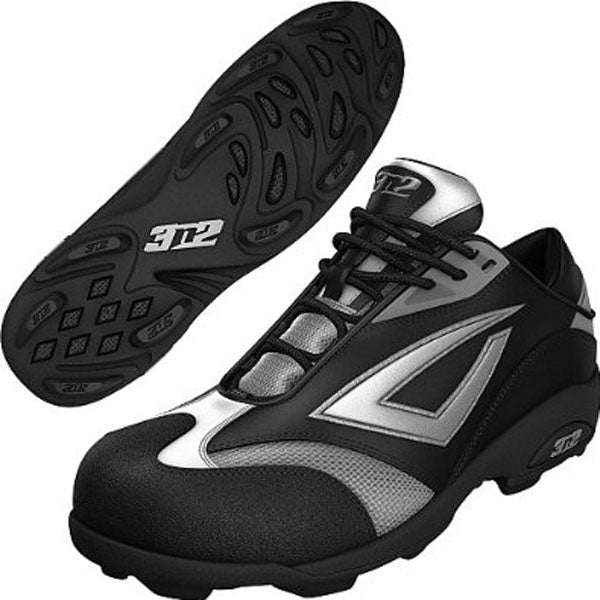 A pair of 3n2 Accelerate Fastpitch Molded Cleats (ACCEL-FP) in black and silver for women. One shoe is shown from the side, the other shows a sole with curved, textured patterns and "312" marked on both cleats.