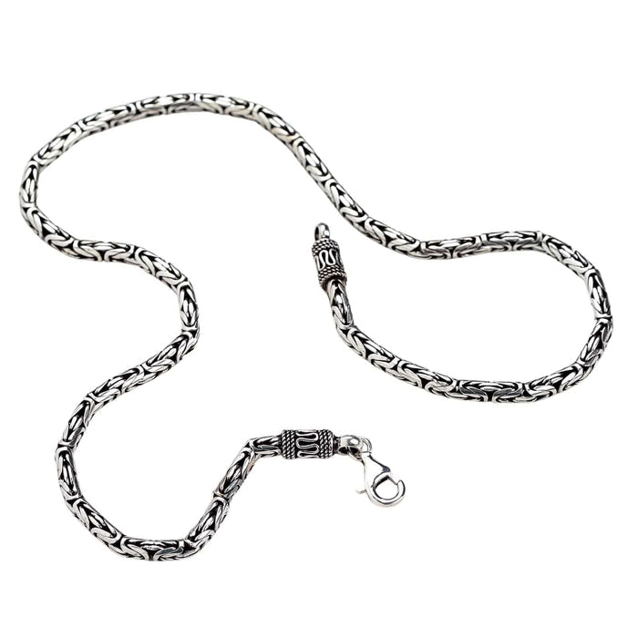 A men's 4mm Byzantine chain in an oxidized, decorative style, showing its intricate, rope-like texture.