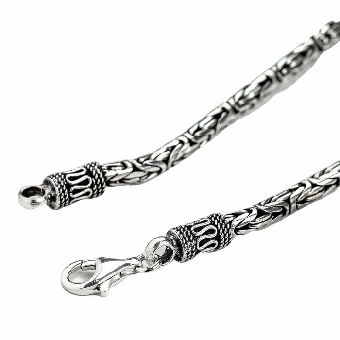 Close-up of the secure lobster clasp and detailed Balinese end cap on the 4mm Byzantine sterling silver necklace.
