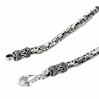 Close-up of the secure lobster clasp and detailed Balinese end cap on the 4mm Byzantine sterling silver necklace.