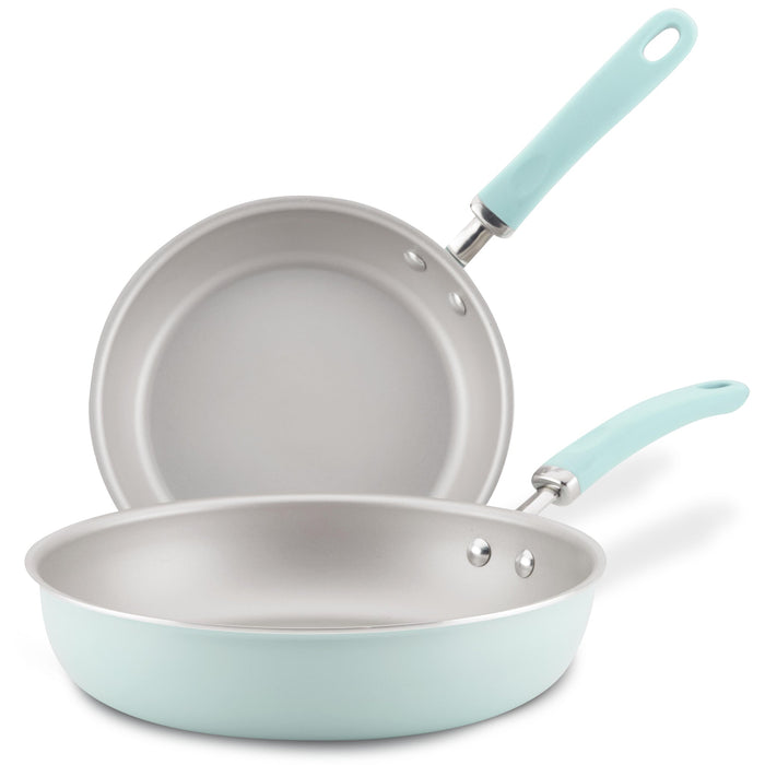Set of 9.5" and 11.75" light blue nonstick induction frying pans, stacked.
