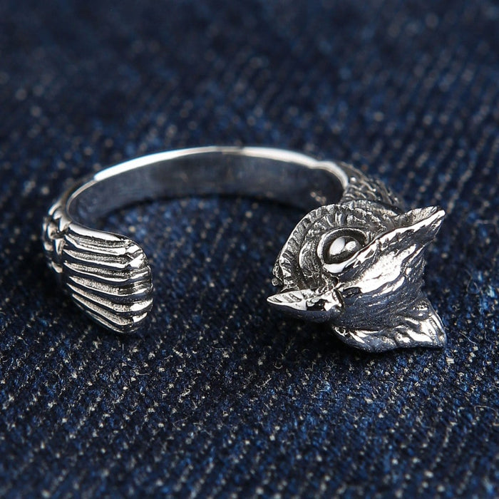 Handcrafted sterling silver owl ring side angle showing carved feather texture and open adjustable band