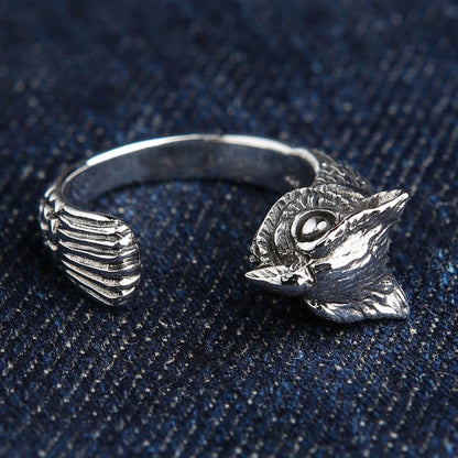 Handcrafted sterling silver owl ring side angle showing carved feather texture and open adjustable band