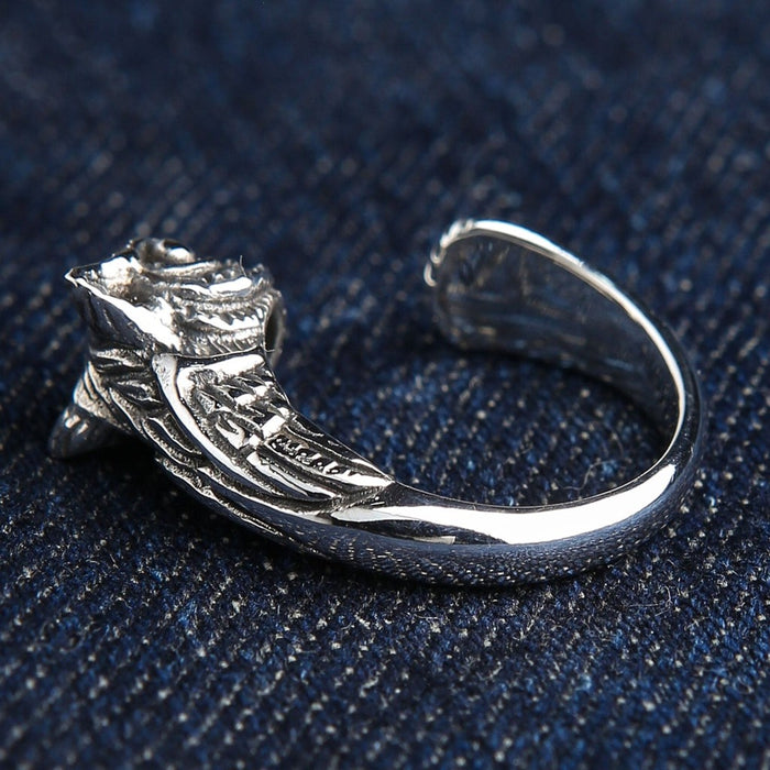 Owl wisdom symbol ring back view displaying hand-carved wing feather pattern in oxidized sterling silver