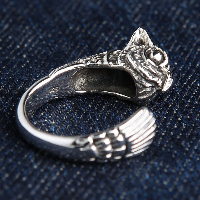 Genuine 925 sterling silver owl ring angled view with visible authenticity stamp and artisan craftsmanship details