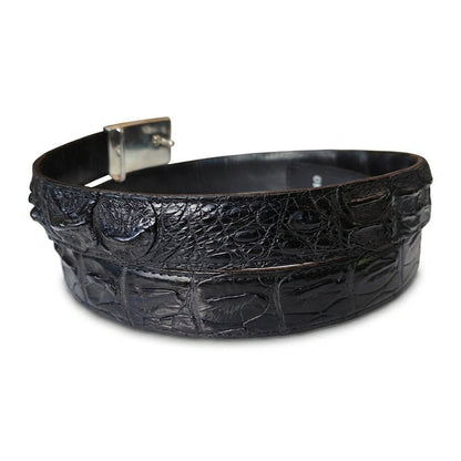 Top-down view of the coiled black crocodile belt with the back of the silver auto-lock buckle facing up.