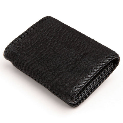 Folded wallet from the back, plain pebbled cowhide panel edged with hand-braided leather lacing