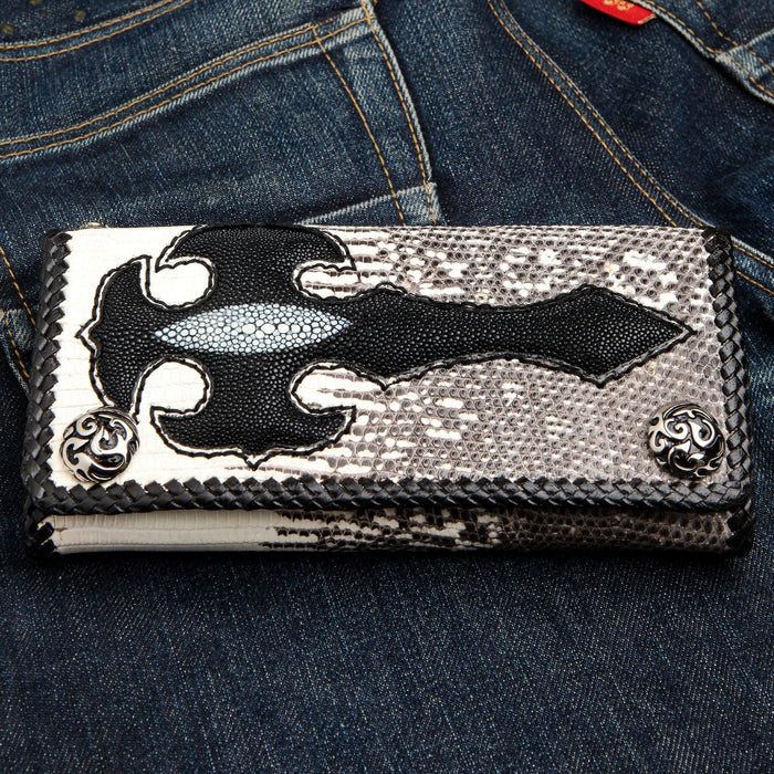 A flat lay of the handcrafted gothic stingray wallet, showing the full tribal cross inlay over the gray lizard skin.