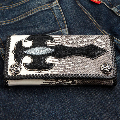 A flat lay of the handcrafted gothic stingray wallet, showing the full tribal cross inlay over the gray lizard skin.