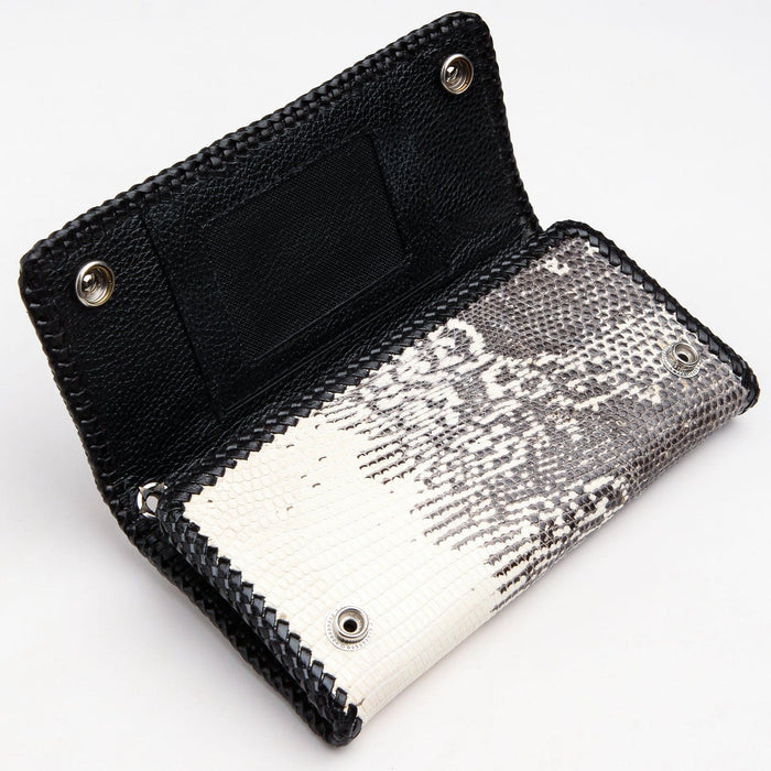A close-up of the wallet's interior, showing the snap-button pocket and the metal grommet for a wallet chain.