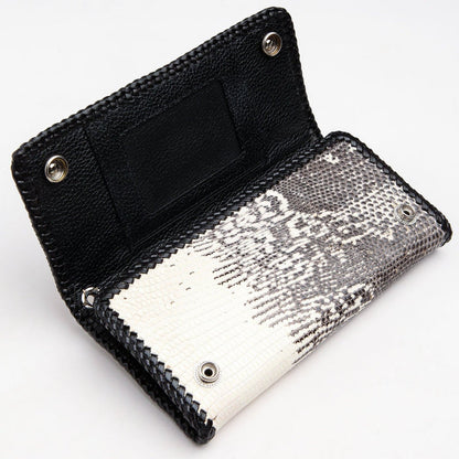 A close-up of the wallet's interior, showing the snap-button pocket and the metal grommet for a wallet chain.