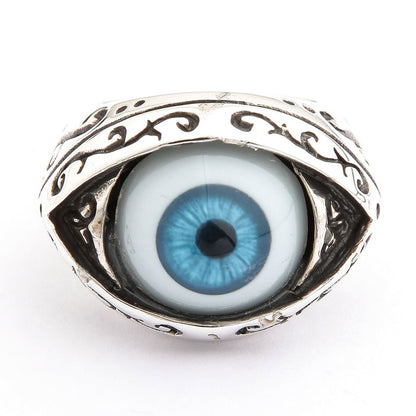 Front view of a blue eyeball ring in sterling silver with a sky-blue iris and oxidized filigree almond bezel