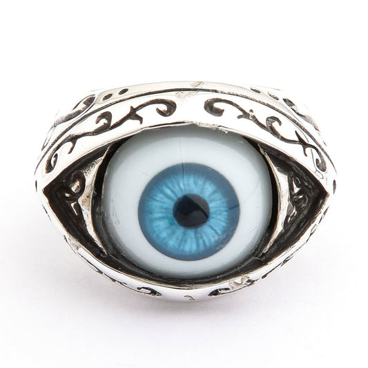 Front view of a blue eyeball ring in sterling silver with a sky-blue iris and oxidized filigree almond bezel