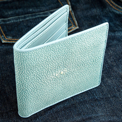 A men's blue turquoise stingray billfold with a light-colored interior and detailed, durable stitching.