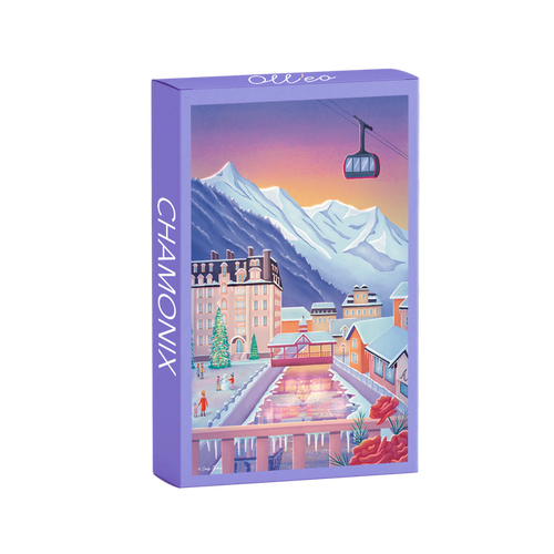 The Chamonix | 99 Piece Jigsaw Puzzle by Olleo Puzzles features Cindy Tardiou's winter scene with mountains, buildings, gondola, and skating rink at sunset—beautiful to display once completed.