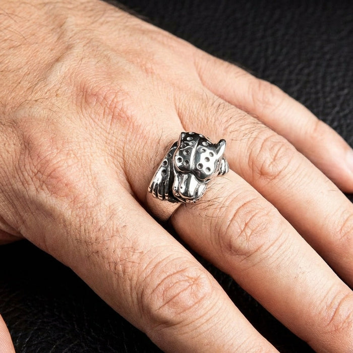 Sterling silver cheetah ring worn on man's hand showcasing bold animal design