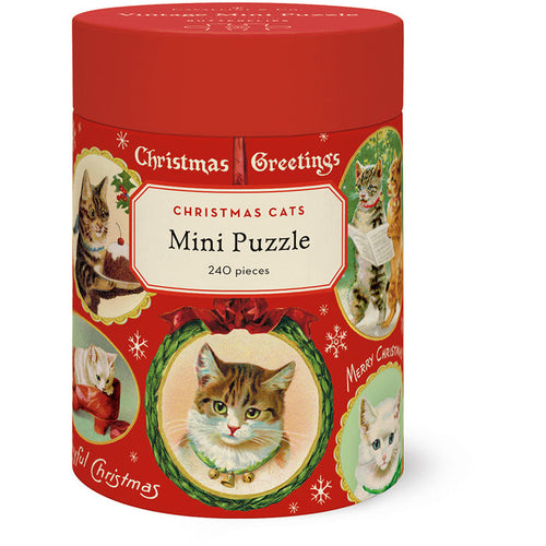 Round red container labeled Christmas Cats | 240 Piece Jigsaw Puzzle by Cavallini & Co., includes a biodegradable bag and features vintage-style Christmas cat illustrations with holiday greetings from the Cavallini archives.