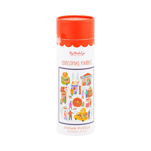 The My Mind's Eye Christmas Market | 500 Piece Jigsaw Puzzle comes in a cylindrical box featuring vibrant market scene artwork, perfect for holiday fun.