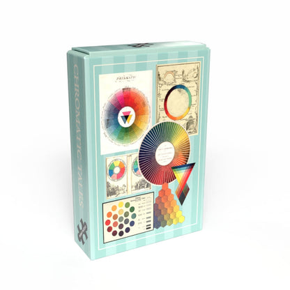 The Penny Puzzle Chromatic Tales | 99 Piece Jigsaw Puzzle comes in a rectangular box featuring color wheels, palettes, and vintage diagrams on the front—perfect for fans of charming minipuzzles.