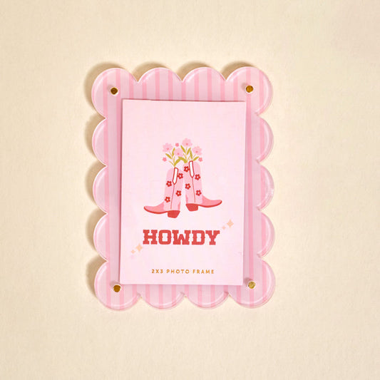 The Darling Effect's Cowgirl Boots Mini Acrylic Picture Frame Magnet features pink scallops, cowboy boots, flowers, and HOWDY—perfect for polaroids or adding a western flair to your fridge photo magnets collection!.