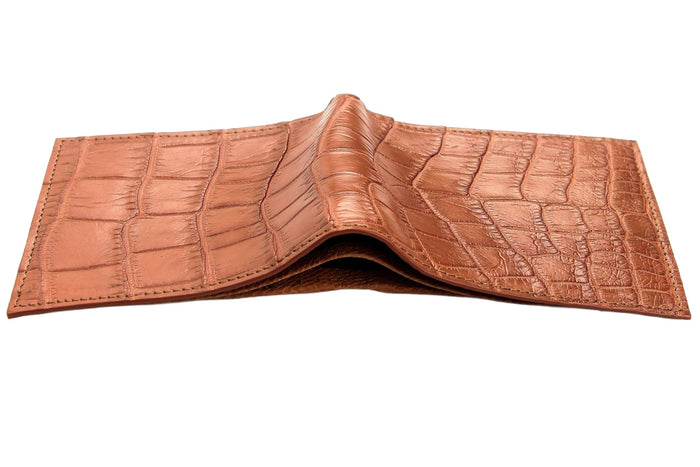 Unfolded exterior seen edge-on, belly tiles running unbroken across both panels and peaking at the center fold.