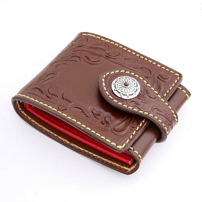 Hero three-quarter angle of a dark brown hand-tooled biker wallet with Western florals and a sterling silver concho.