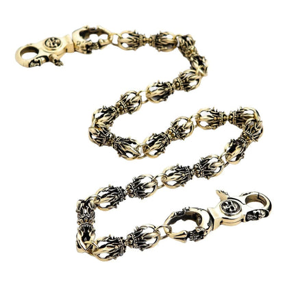 A heavy, 160-gram Tibetan Dorje wallet chain in solid polished brass, laid out to show its intricate, spiritual links.