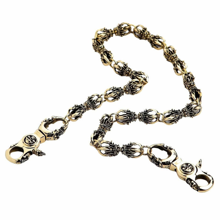 Close-up of the gothic skull lobster clasp and round cross medallion on the solid brass Dorje wallet chain.