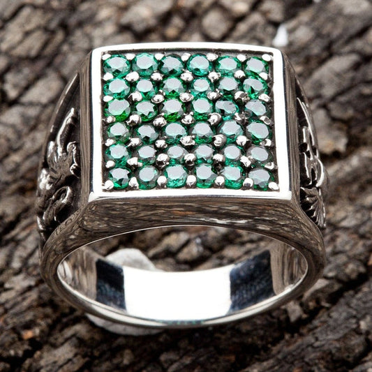 Men's emerald green CZ signet ring in 925 sterling silver top view showing 36 green stones