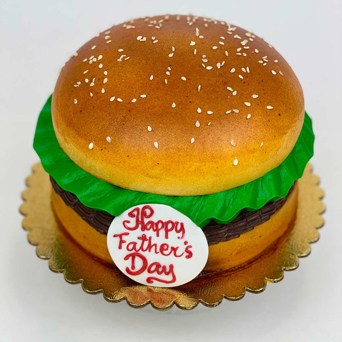 Father's Day Burger Cake with a "Happy Father's Day" sign
