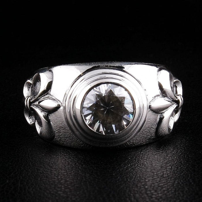 Front view of handcrafted sterling silver ring with 3-carat topaz and dual Fleur De Lis symbols