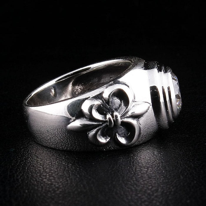 Left side view of medieval-inspired silver ring displaying Fleur De Lis craftsmanship and polished finish