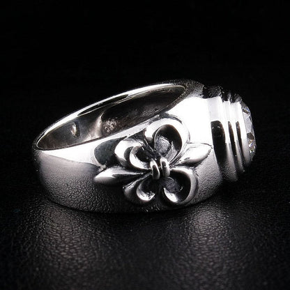 Left side view of medieval-inspired silver ring displaying Fleur De Lis craftsmanship and polished finish