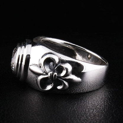 Back angle of .925 hallmarked sterling silver ring with Fleur De Lis design and topaz gemstone setting