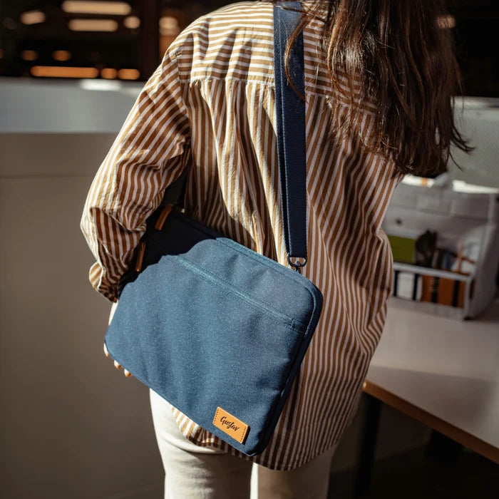 Flow laptop sleeve – lifestyle shot at a shared desk