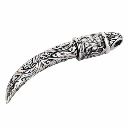 A unique piece of spiritual jewelry: a solid sterling silver tusk featuring the powerful Hindu god Ganesh on its cap.