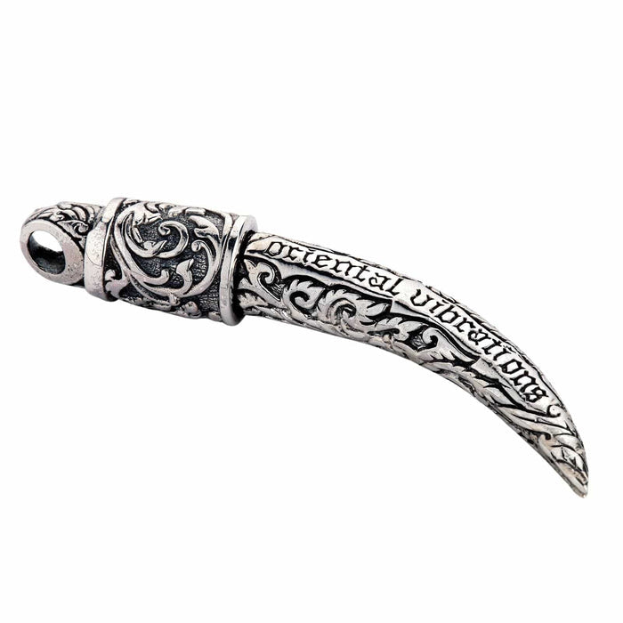 A beautifully handcrafted solid silver tusk pendant with a high-contrast polished and dark, oxidized finish.