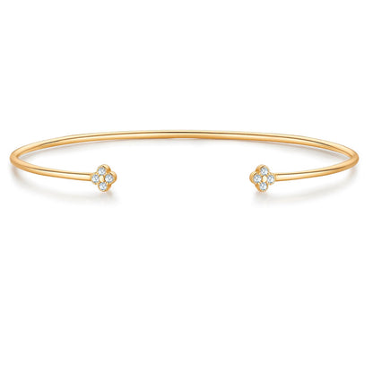 Goldener Armreif mit Blüten-Anhänger