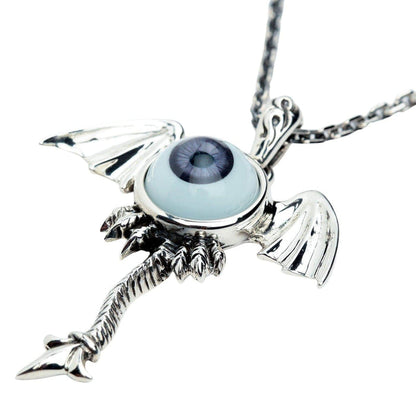 An alternative angle of the large statement gothic necklace, highlighting the detailed silverwork and purple eye.