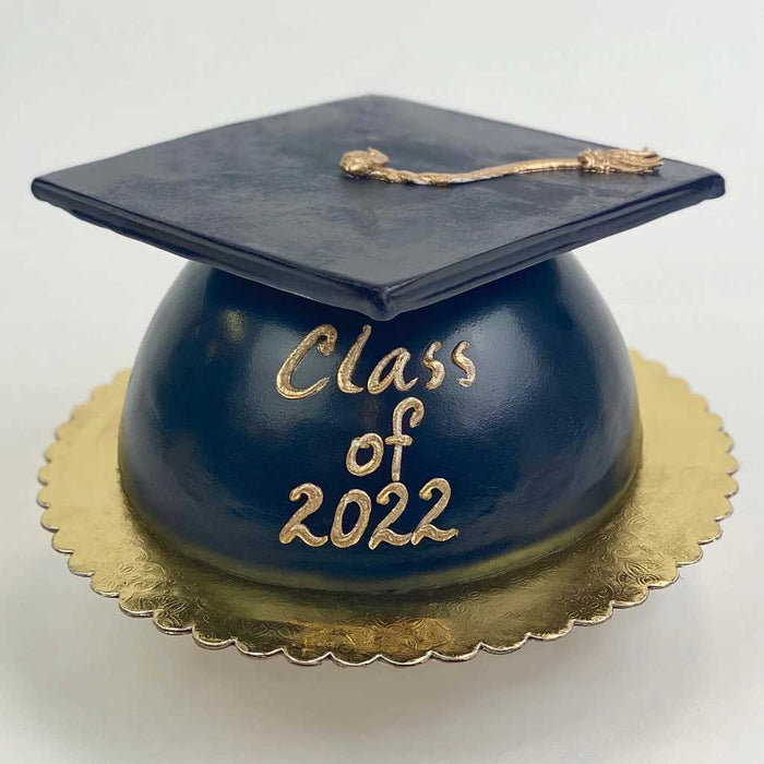Black Grad Cap Cake featuring a golden tassel, gold base, and a “Class of 2022” message in gold