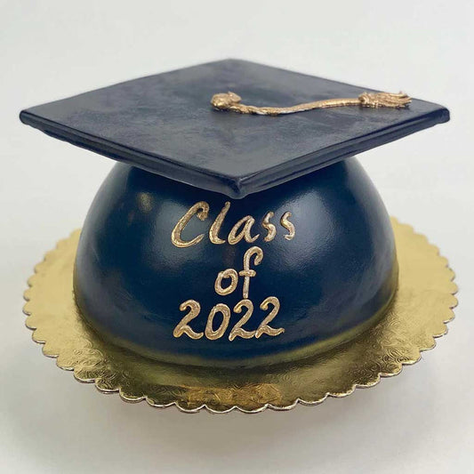 Black Grad Cap Cake featuring a golden tassel, gold base, and a “Class of 2022” message in gold